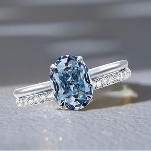 Italo Oval Cut Blue Topaz Solitaire Engagement Ring Set